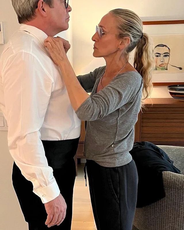 Sarah Jessica Parker ties Matthew Broderick's bow tie in their NY home