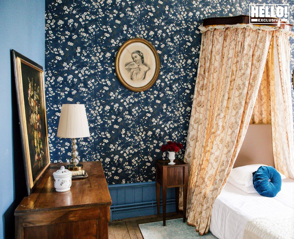 Catherine Roger's bedroom with floral wallpaper at Chateau Marcellus near Bordeaux