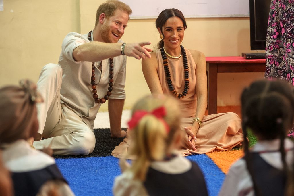 Prince Harry and Meghan Markle in a classroom