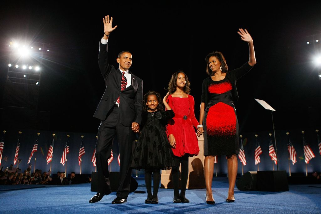 Barack Obama stands on stage along with his wife Michelle and daughters Malia and Sasha during an election night gathering in Grant Park on November 4, 2008 in Chicago, Illinois