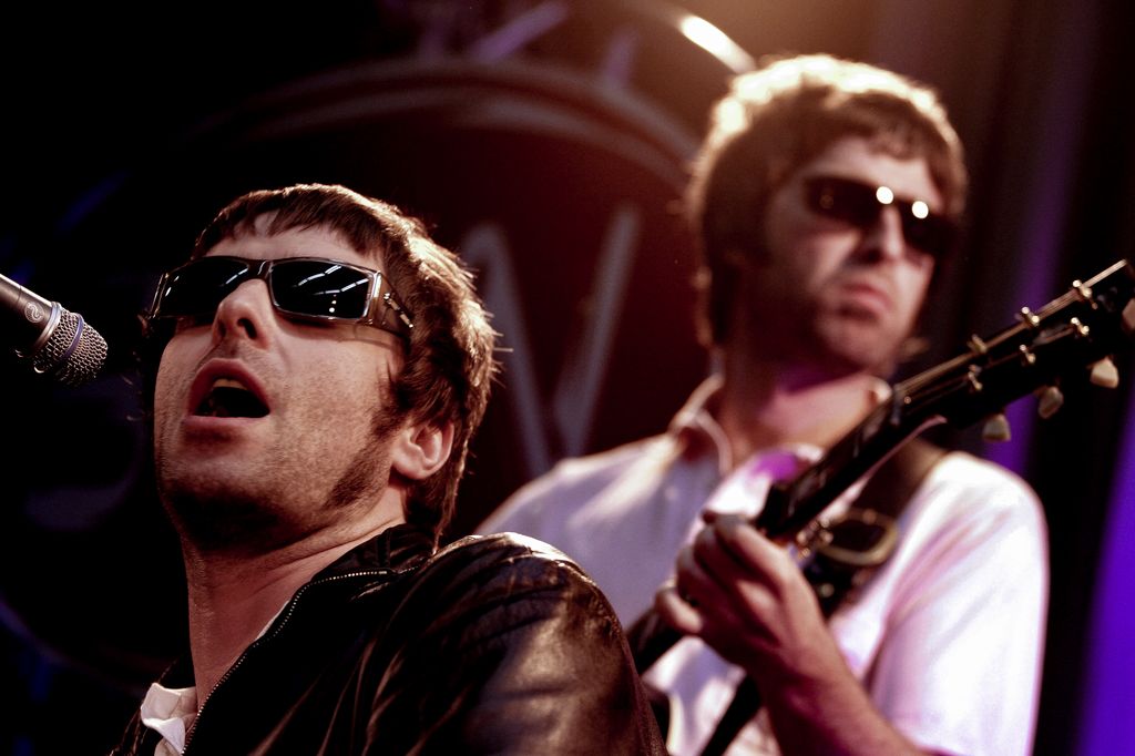  Liam and Noel Gallagher of Oasis perfom live on stage at Wisseloord Studios in sunglasses