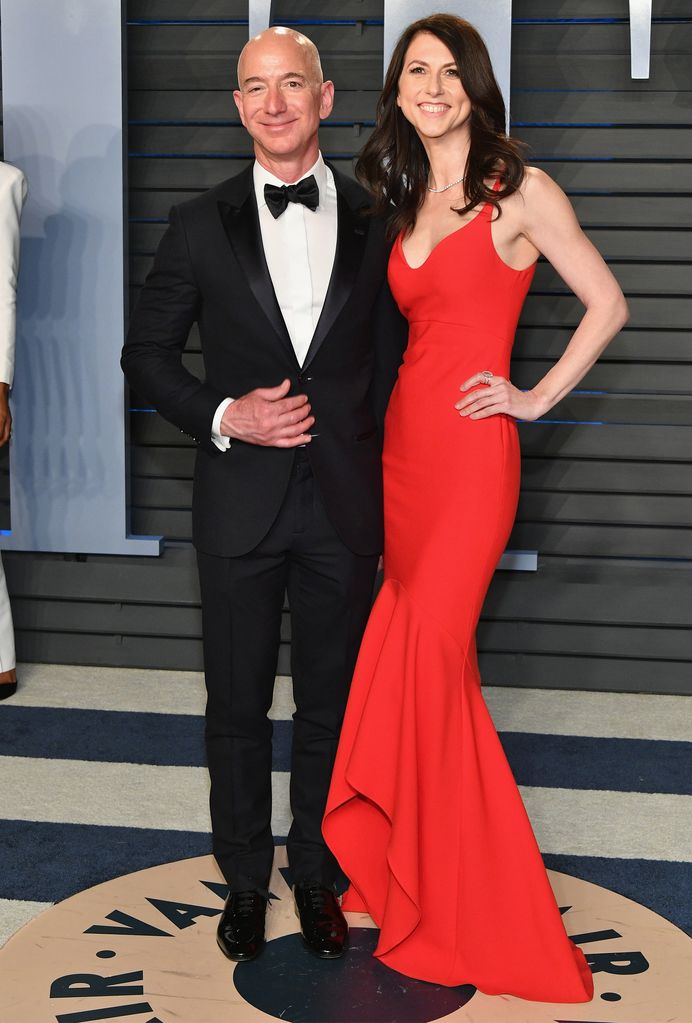 Jeff Bezos in a suit with his ex-wife MacKenzie Bezos in a red dress