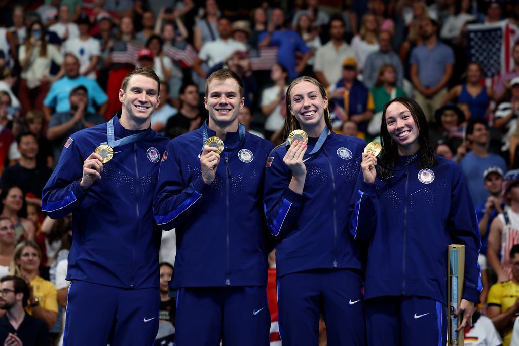 Gold Medalists Ryan Murphy, Nic Fink, Gretchen Walsh and Torri Huske of Team United States pose on the podium during the Swimming medal ceremony after the Mixed 4x100m Medley Relay Final on day eight of the Olympic Games Paris 2024 at Paris La Defense Arena on August 03, 2024 in Nanterre, France