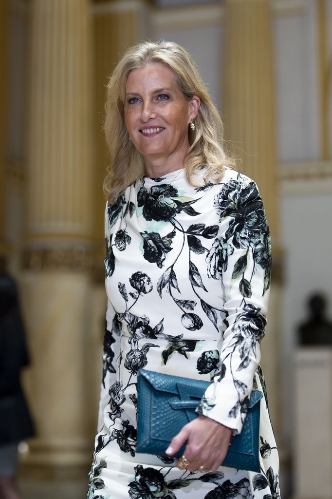 The Duchess of Edinburgh smiling in black and white floral dress