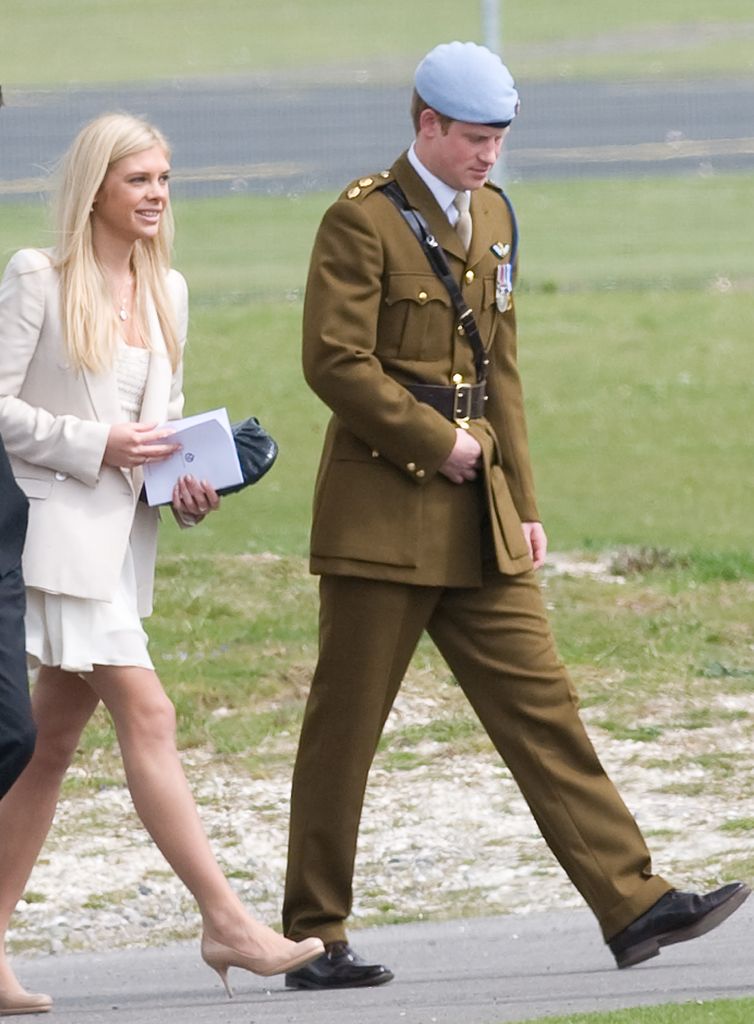 Chelsy Davy in a white dress and Prince Harry in uniform