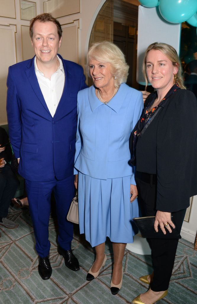 Tom Parker Bowles standing with Queen Camilla and Laura Lopes