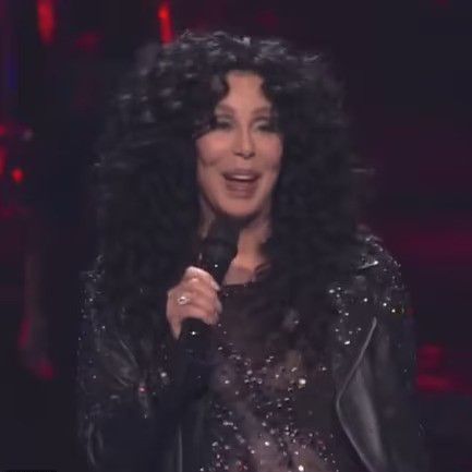 cher on stage with mircrophone