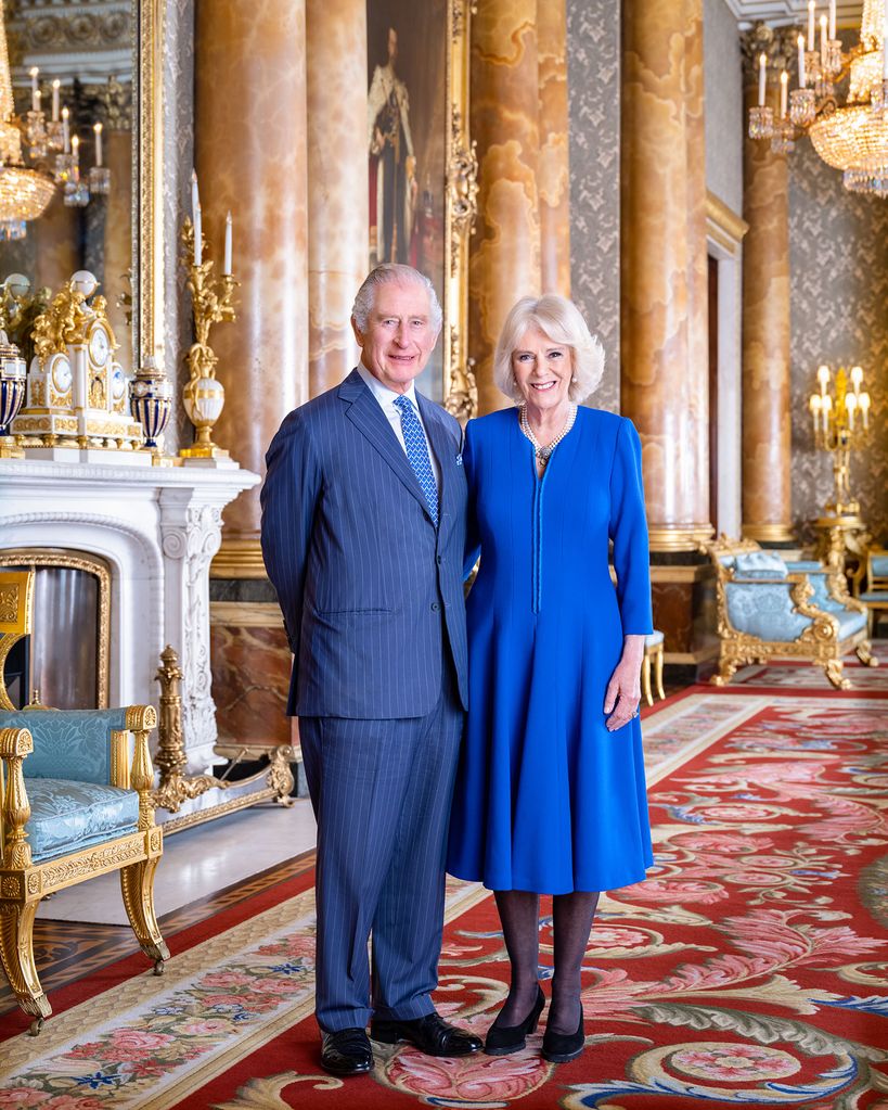 The King and Queen Consort pose for a portrait in the blue drawing room at Buckingham Palace