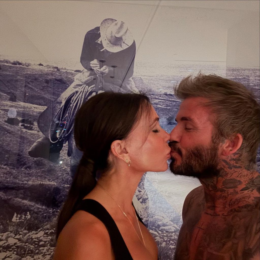 David and Victoria Beckham kissing