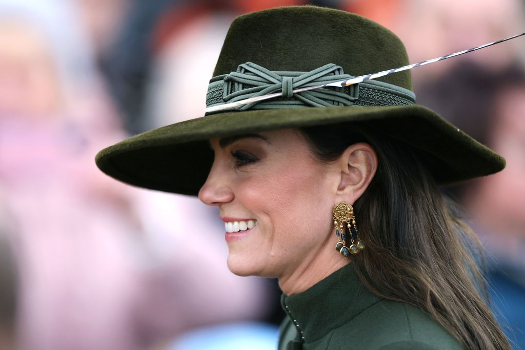 princess kate side profile wearing hat and statement earrings