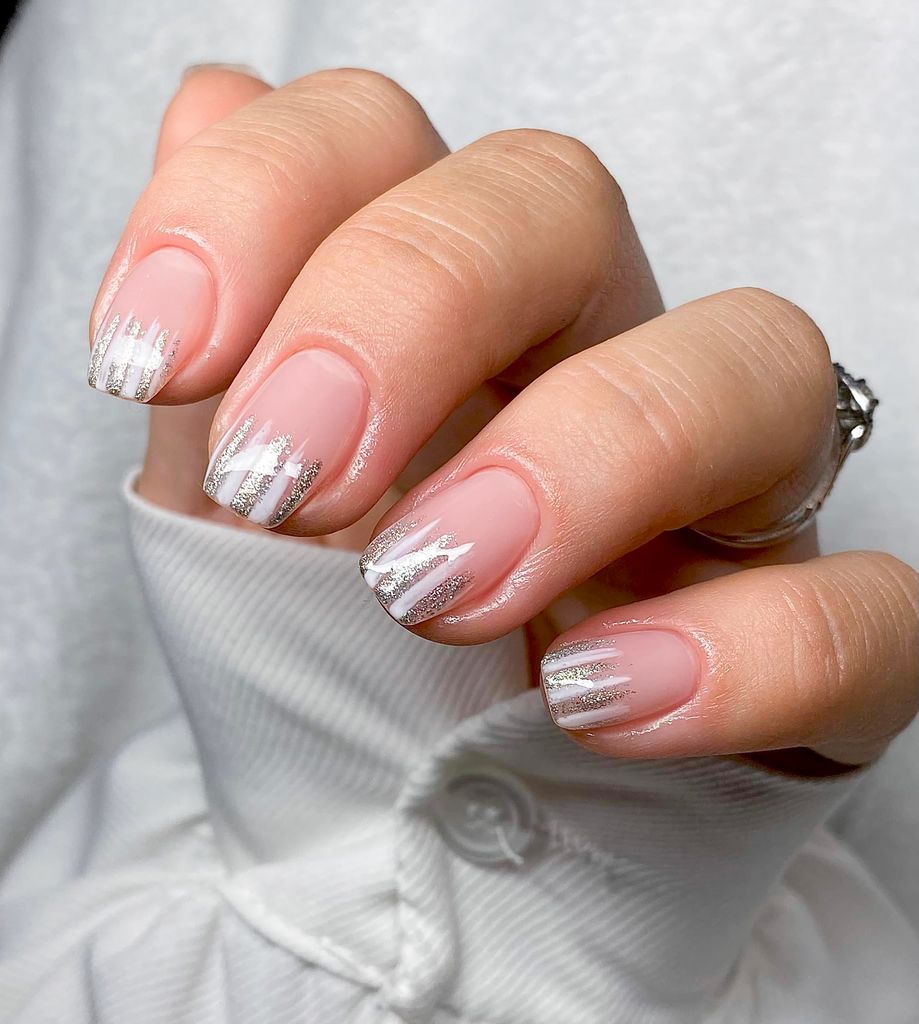 Metallic accents on neutral nails