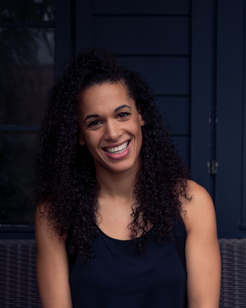 Smiling brunette woman in a vest top