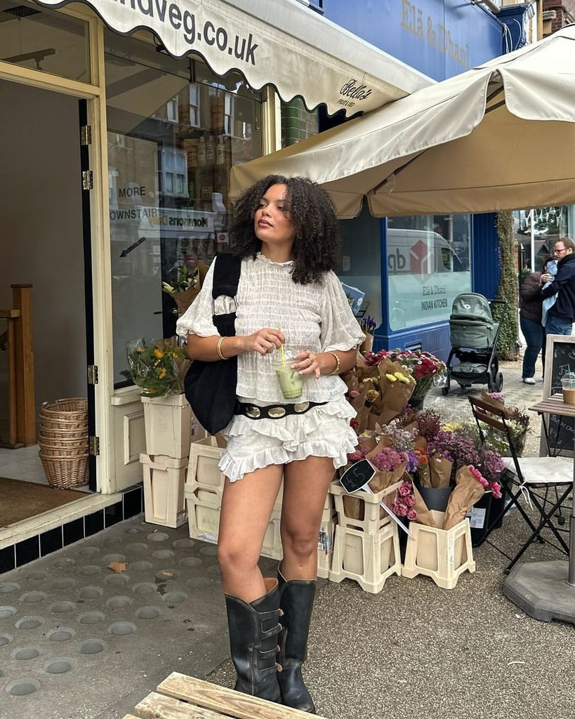 @nicolekimberleystark in boots and rara skirt