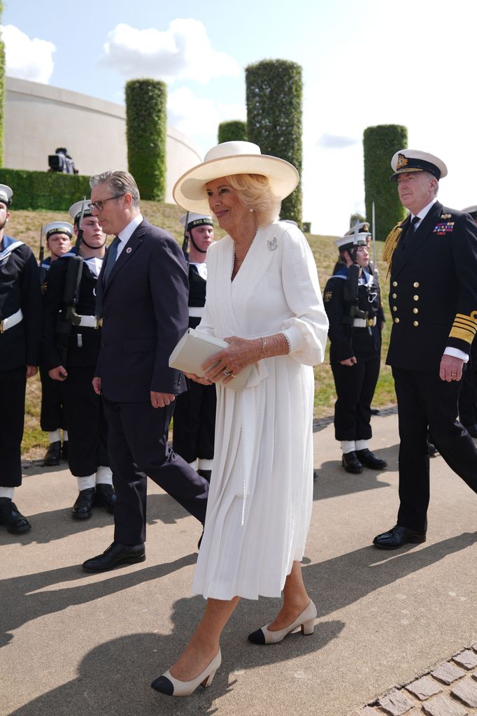Queen Camilla wearing white dress