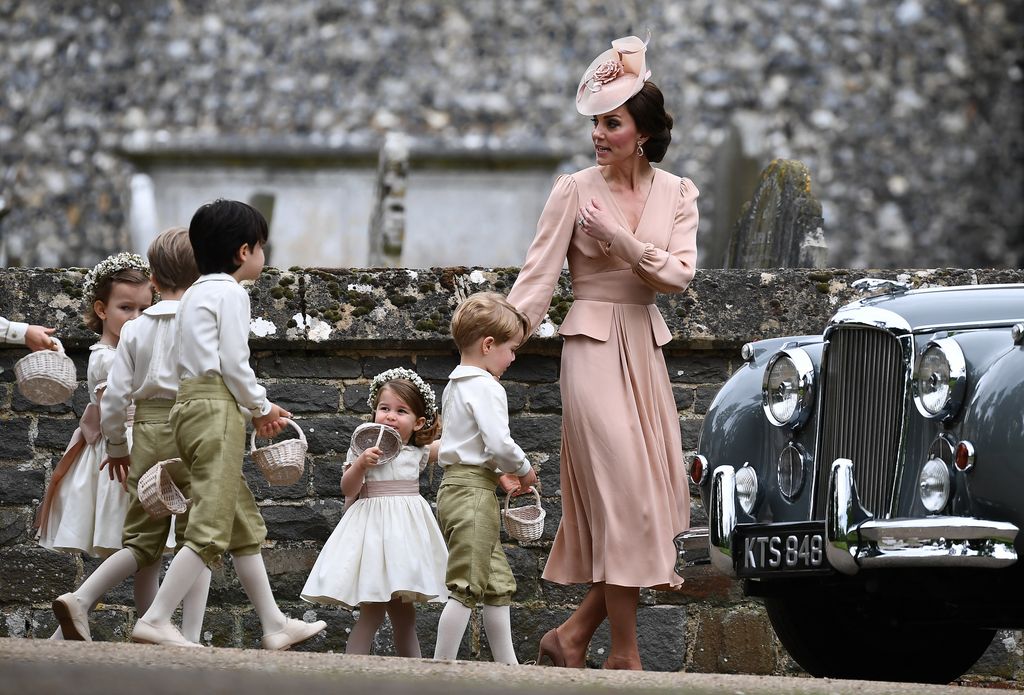 The Princess of Wales leading the children