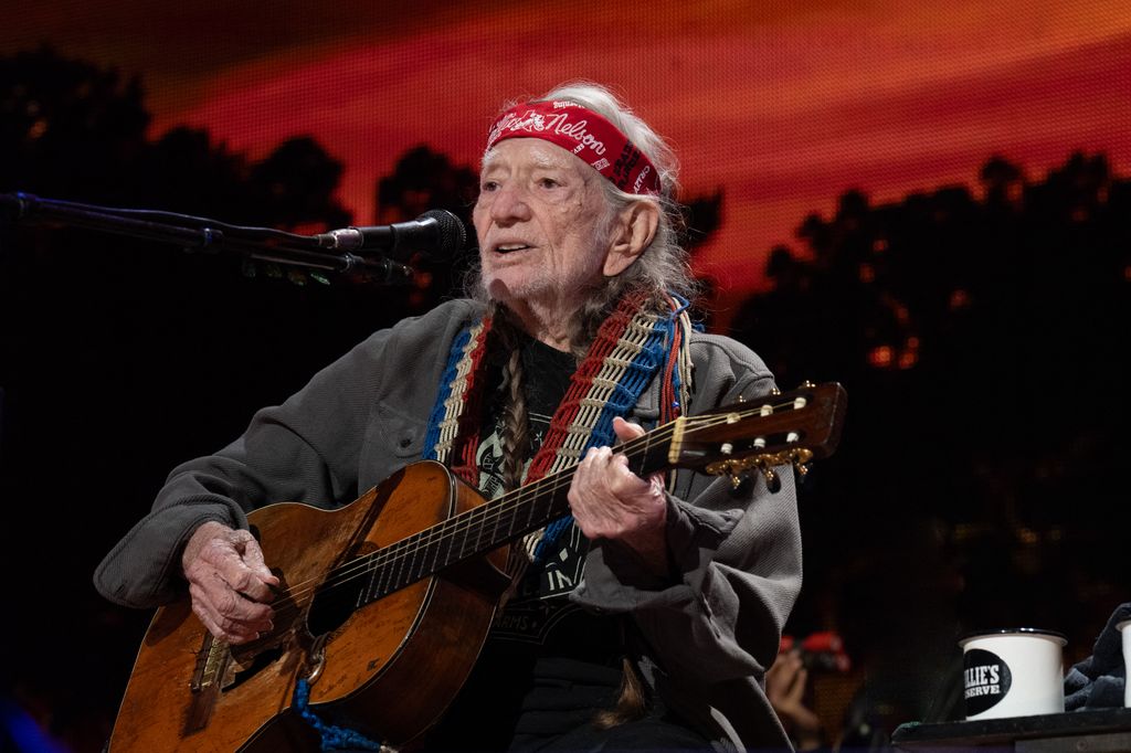 willie nelson performing on stage