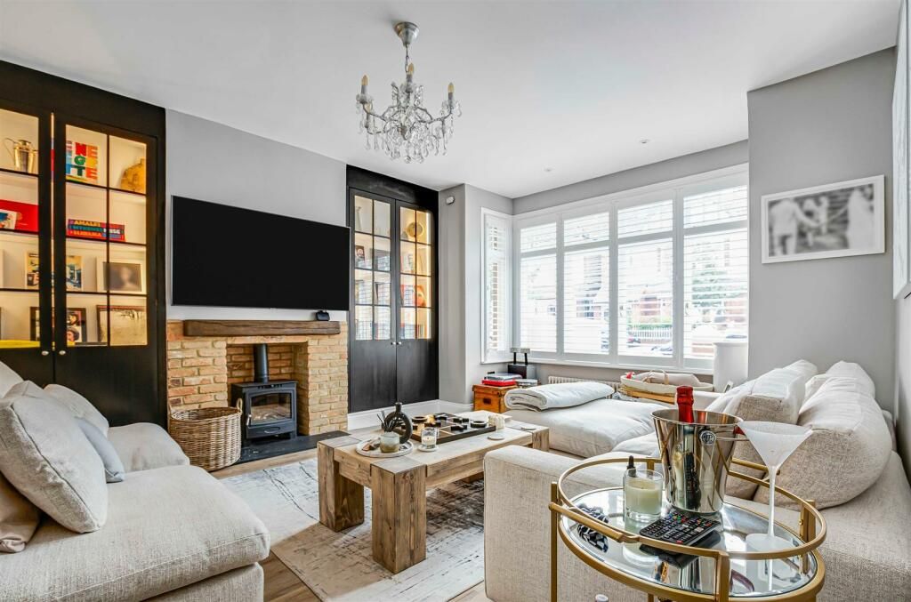 neutral living space with black door shelving