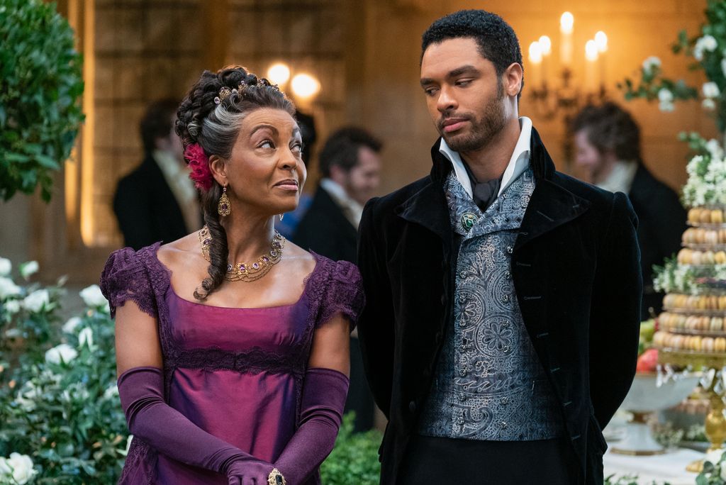 BRIDGERTON (L to R) ADJOA ANDOH as LADY DANBURY and REGÃ-JEAN PAGE as SIMON BASSET in episode 108 of BRIDGERTON