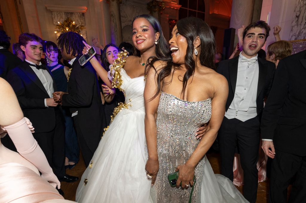 Bronwyn Vance and Angela Bassett dancing in gowns