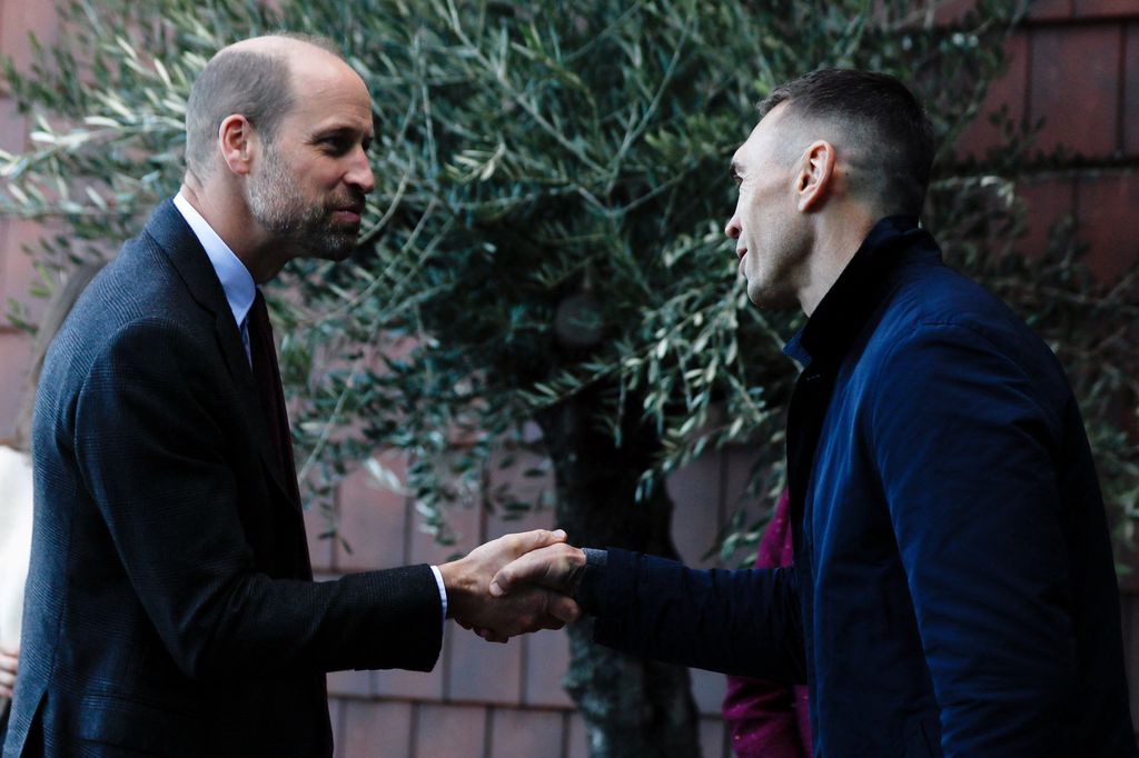 William is welcomed by rugby union coach Kevin Sinfield during a visit to the Rob Burrow Centre