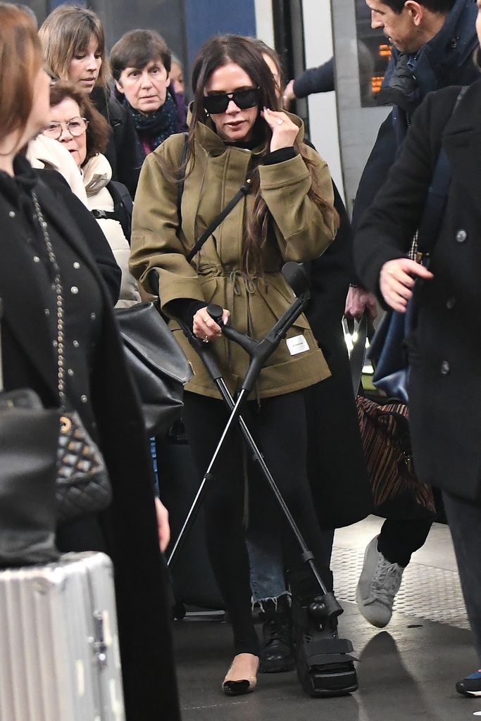 Victoria Beckham seen walking on crutches as she arrived in Paris