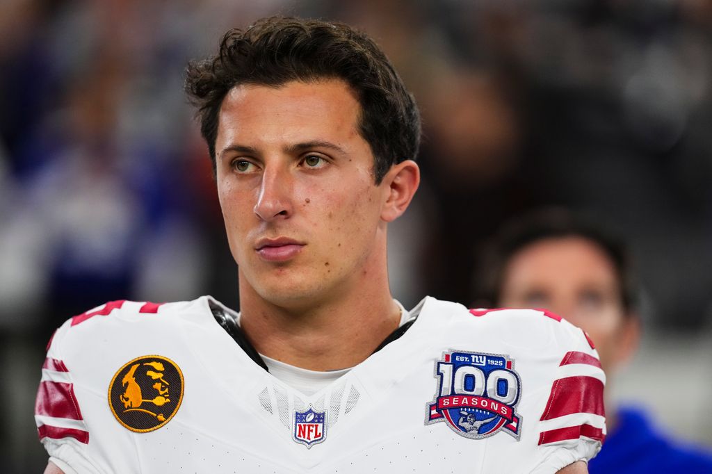 Tommy DeVito #15 of the New York Giants looks on from the sideline prior to an NFL football game against the Dallas Cowboys at AT&T Stadium on November 28, 2024 in Arlington, Texas. (Photo by Cooper Neill/Getty Images)