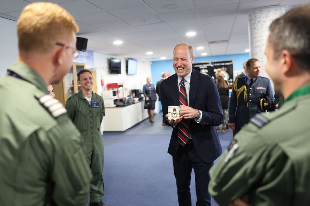 Prince William talks to RAF personnel during an official visit at RAF Valley