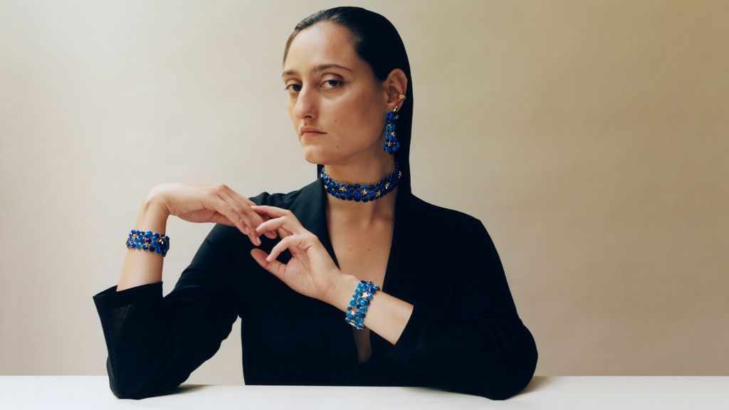 model wearing blue jewellery