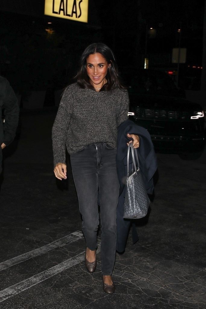Meghan Markle rocked skinny jeans and a soft knit sweater as she left a business dinner with the Executive Producer of Oprah