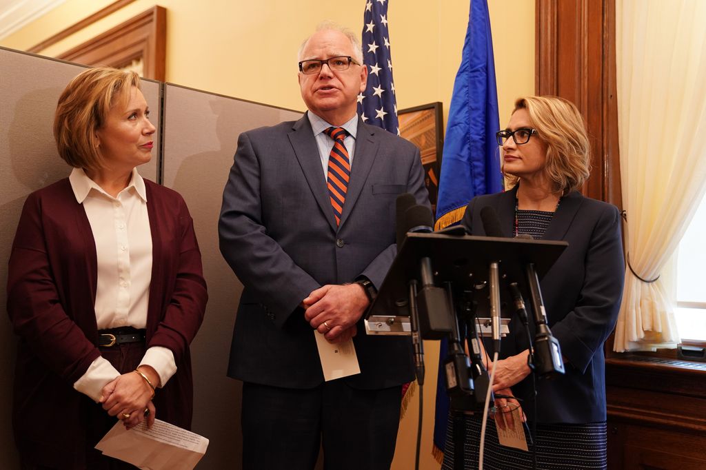 Tim Walz, center, his wife Gwen, left, and Lt. Governor-elect Peggy Flanagan, at the State Capitol Thursday morning, November. 8, 2018 