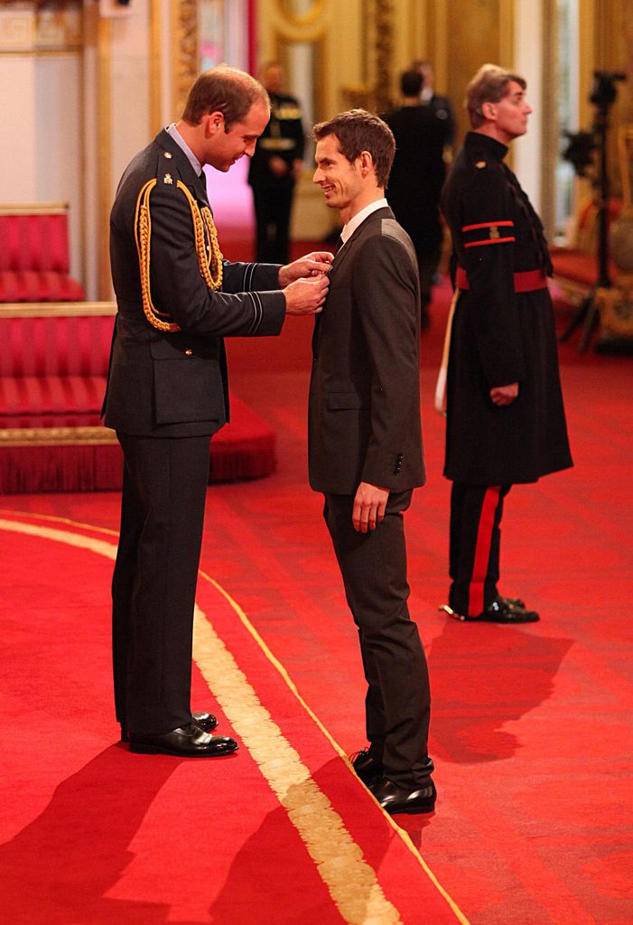 Prince William awarding Andy Murray with his OBE at his first investiture in 2013