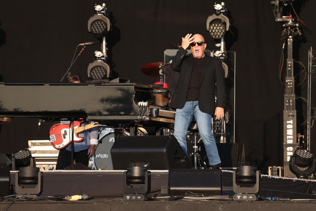Billy Joel stands by. his piano at BST Hyde Park