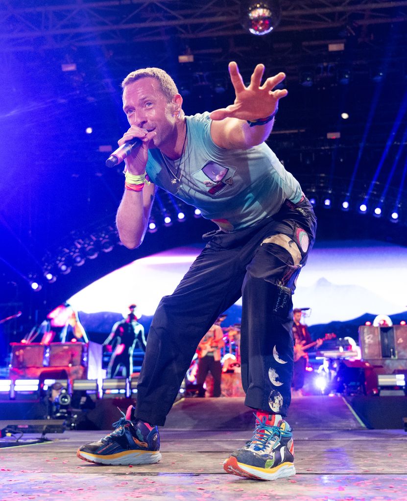 Chris Martin of Coldplay performs as the band headline the Pyramid stage during day four of Glastonbury Festival 2024