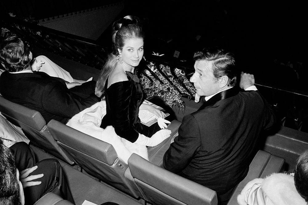 Princess Grace and Yves Montand sat together at the Grand Prix premiere