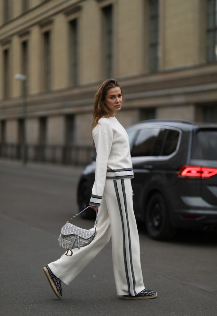 Nicole Poturalski wearing a total Dior beige look and Dior Saddle bag