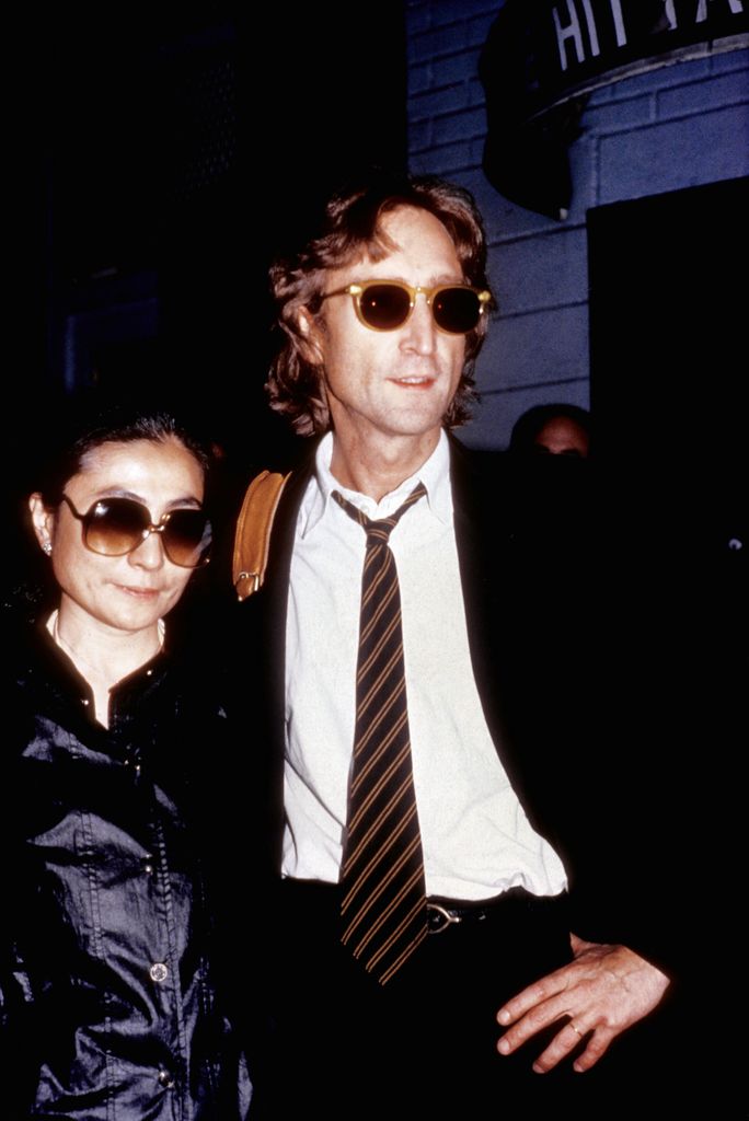 NEW YORK - AUGUST 1980: Former Beatle John Lennon and his wife Yoko Ono outside of the Times Square recording studio 'The Hit Factory' before a recording session of his final album 'Double Fanasy' in August 1980 in New York City, New York.  (Photo by Vinnie Zuffante/Getty Images)