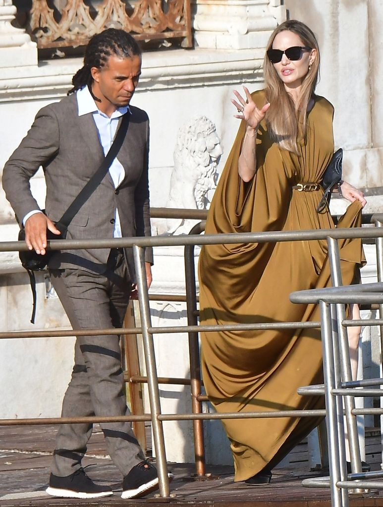 Angelina Jolie seen with rapper Akala as they are seen leaving the hotel to attend the the Maria premiere during the Venice Film Festival