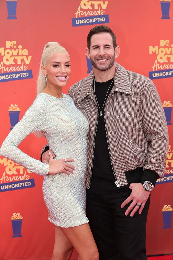 Heather Rae El Moussa and Tarek El Moussa attend the 2022 MTV Movie & TV Awards: UNSCRIPTED at Barker Hangar in Santa Monica, California and broadcast on June 5, 2022.