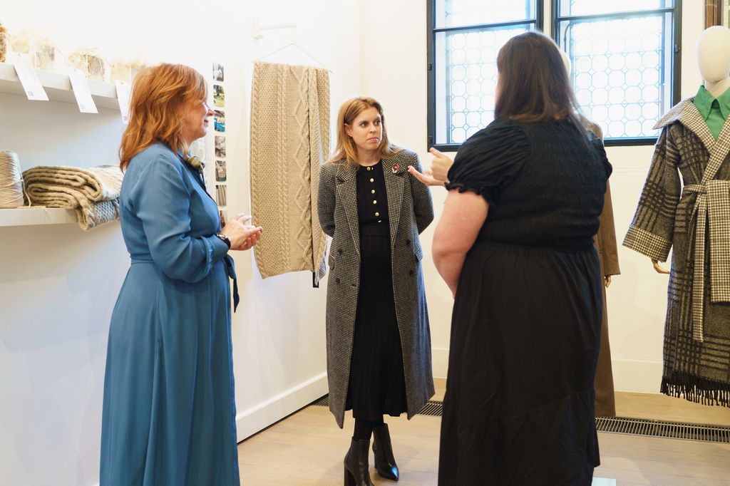 Beatrice looked elegant in a button-down dress and leather boots 