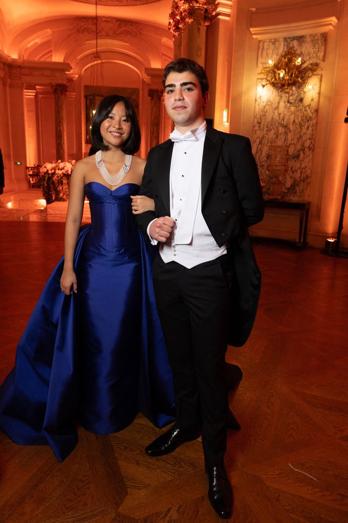 Jillian Chan in cobalt dress with cavalier Nikolas Manos