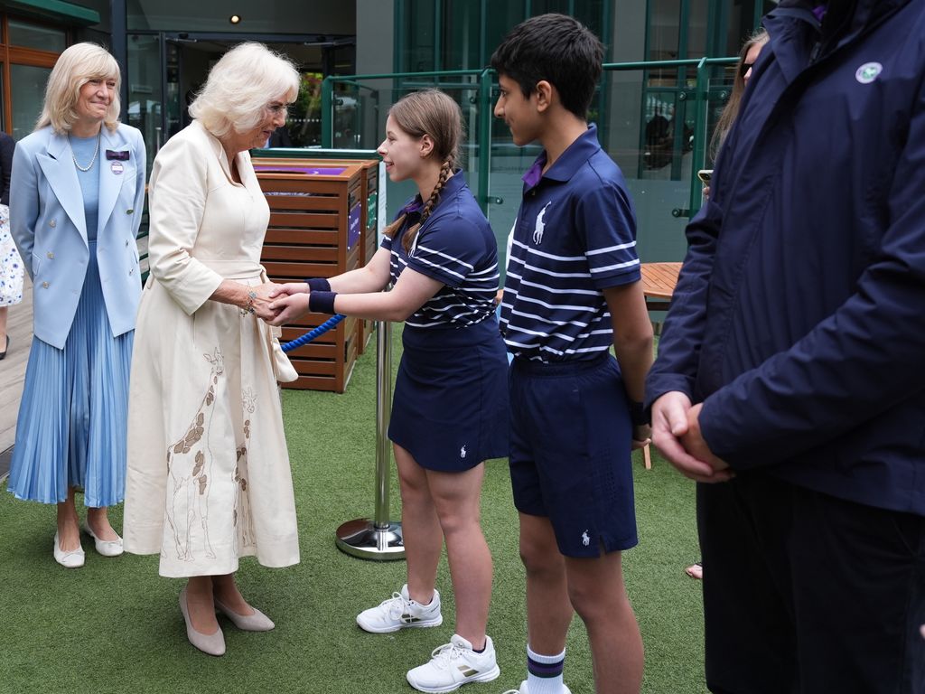The Queen met ball kids Natalia from Burntwood School in Wandsworth and Yug from Harris Academy Wimbledon