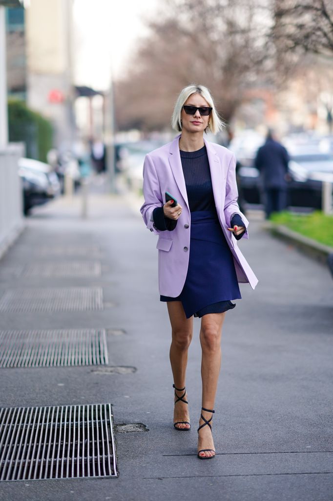 woman wearing purple outfit on street