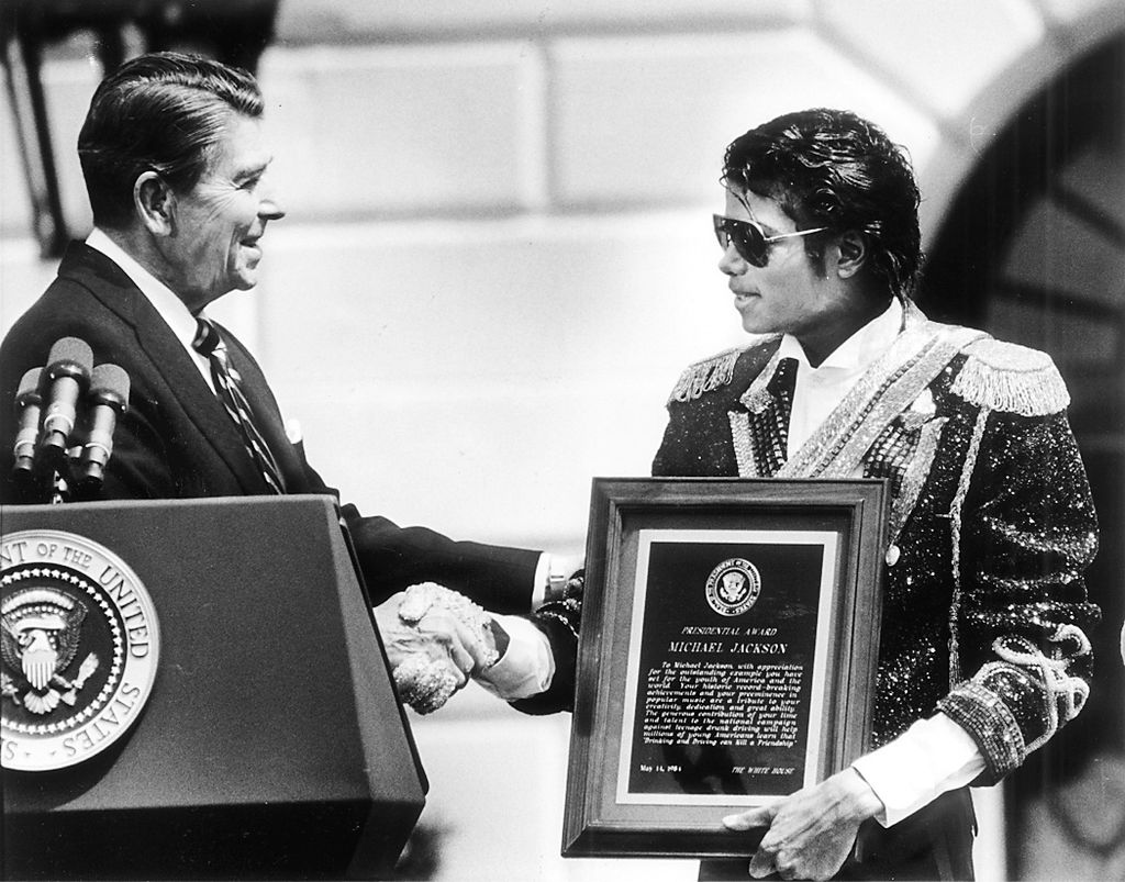Michael Jackson (right) receiving a Presidential Award from Ronald Reagan