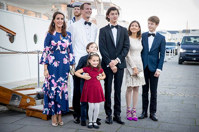 Princess Marie with Prince Joachim and five children stood outside a boat