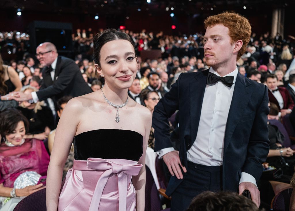 Mikey joined by her brother Miles at the 97th Academy Awards