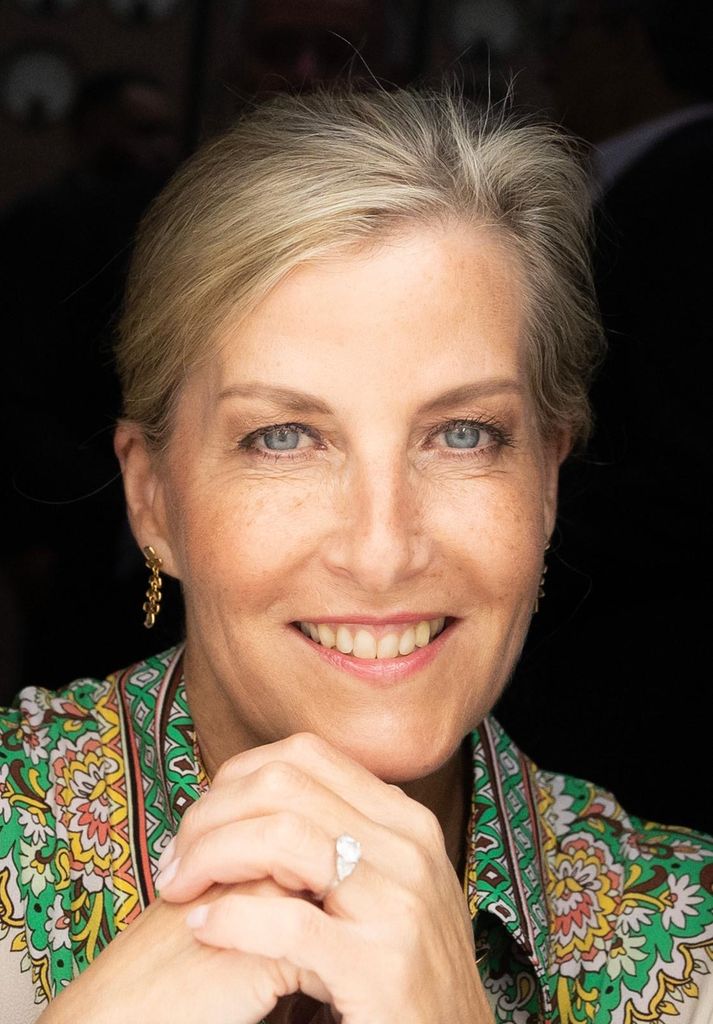 Close-up of the Duchess of Edinburgh's face smiling and wearing printed dress