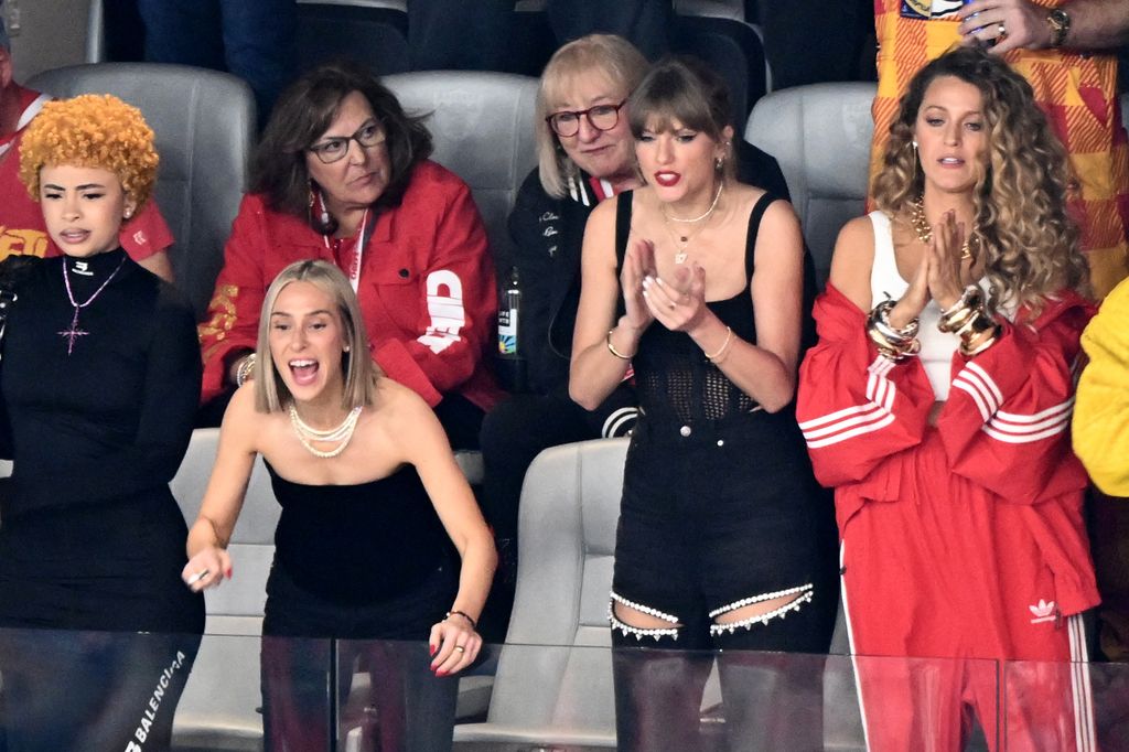 Taylor Swift applauding at the Super Bowl 
