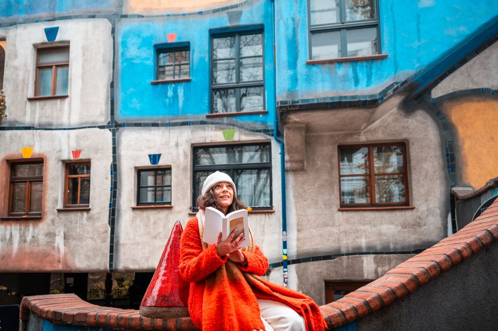Woman reading a book in the old town of Vienna, Austria