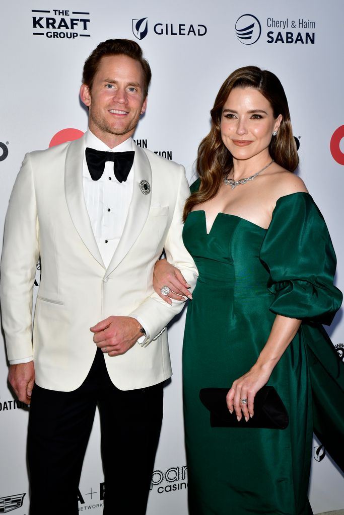 Grant Hughes and Sophia Bush arrive at Elton John AIDS Foundation's 31st Annual Academy Awards Viewing Party on March 12, 2023 in West Hollywood, California
