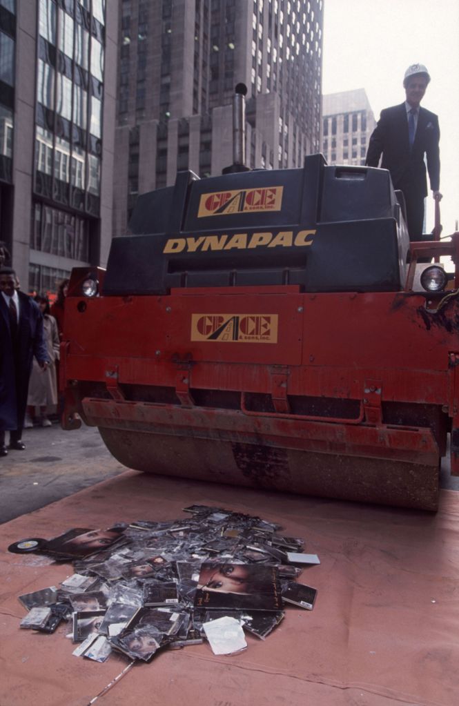 A steam roller destroys albums by Sinead O'Connor, New York, New York, October 25, 1992. This was done in the wake of her performance on 'Saturday Night Live' where she tore a photograph of Pope John Paul in protest of child sexual abuse.